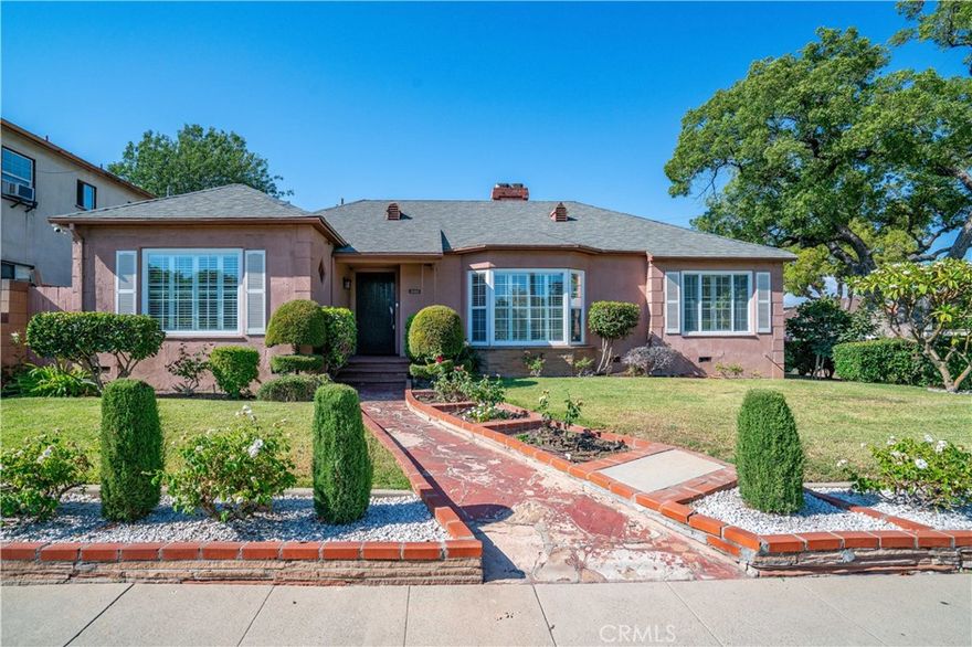 Versatile Living + Income Opportunity in Alhambra! Welcome to this charming residence ideally located across from the lush greenery of Granada Park. The main home showcases 3 bedrooms and 2 bathrooms, blending timeless character with modern comfort. A bright and inviting living room sets the tone with a beautiful bay window, rich hardwood floors, and an elegant fireplace, the perfect backdrop for both intimate gatherings and larger celebrations. The spacious formal dining room flows seamlessly into the kitchen, where warm cabinetry, abundant counter space, and natural light create a welcoming space for everyday living. Down the main hall, two generously sized bedrooms feature ample closet space, while the bathrooms offer a combination of classic tile details, updated vanities, and thoughtful storage.  Adding incredible versatility, the property also includes two additional one-bedroom, one-bathroom units situated above the garage, each with its own private entry. These units provide exceptional opportunities for extended family, guests, or rental income, making this home as practical as it is inviting. Outdoors, the front yard greets you with manicured landscaping, mature trees, and colorful blooms framed by a charming gated entry. A rear driveway and garages offer ample parking, while the side and backyard areas provide space for gardening, storage, or a private retreat. Nestled on a beautiful tree-lined street, this residence combines comfort and convenience with unbeatable proximity to shopping, dining, schools, and recreation at Granada Park just across the street. Whether you’re seeking a forever home or a unique investment with multiple living options, this property is truly an opportunity not to be missed!