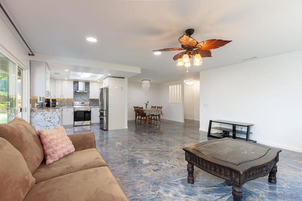 Gorgeous, fully updated 4 bedroom home sitting on over 1/2 acre with OWNED SOLAR! Owner has extensively remodeled over the years and upgraded with a new kitchen, new bathrooms, custom lighting, porcelain floor tiles, new dual pane widows, new HVAC, new paint, exterior stucco, new concrete driveway, retaining walls and many more projects. The pride of ownership really shows! Situated in a lovely hillside neighborhood surrounded by relaxing mountain views and other custom homes. The vacant land across the street is included with the property. Great opportunity to explore potential for an extra garage, RV or boat parking, an ADU or a horse corral. Zoned Q for horses and certain breeds of animals. Buyer to investigate and confirm allowed uses for the land. Homes this well cared for are rare. Don't miss this opportunity.