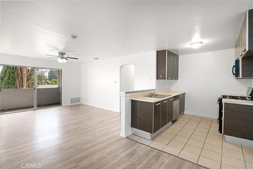 LOW HOA DUES – ONLY $275 PER MONTH! UNIT #308 Seller will entertain installing an in unit laundry. Discover this stylishly updated top-floor corner unit condo in the heart of Canoga Park, complete with elevator access for easy living. Offering 1,000 sq. ft. of well-designed space, this 2-bedroom, 2-bath residence is ideal for first-time homeowners, or anyone seeking comfort and convenience in the city.



Inside, the open layout welcomes you with abundant natural light pouring through oversized windows. The inviting living room flows seamlessly to a private balcony, perfect for unwinding or enjoying views of the neighborhood. NEW FLOORING AND PAINT throughout and plenty of cabinetry, while the adjoining dining area provides the perfect spot to share meals and entertain guests.



The primary suite feels like a true retreat, with a private en-suite bath, large closet, and an extra bonus area that’s perfect for a home office, cozy lounge, or creative space. The secondary bedroom and additional full bath add versatility for family, guests, or additional workspace.



Community amenities include shared laundry, central air and heat, and two secure parking spaces. Located minutes from The Village at Westfield Topanga, shops, restaurants, and public transit, and local farmers market this home combines modern upgrades with unbeatable convenience.



Don’t miss out on this exceptional opportunity—schedule your private tour today!