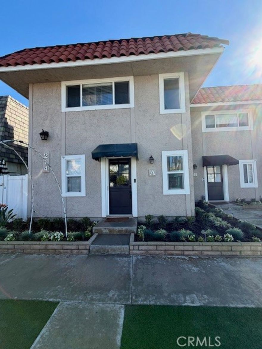 Rare opportunity to lease this beautifully remodeled coastal townhome just steps from the sand in Huntington Beach. This two-story home offers ocean and Catalina Island views from the front outdoor space and features a charming Dutch door entry, crown molding, oversized windows, and a bright open floor plan. The living room includes recessed lighting and a fireplace and connects to the dining area with sliding doors leading to a private patio.

The upgraded kitchen features white cabinetry, a 2023 custom tile backsplash, stainless steel appliances, soft-close drawers, and in-cabinet/under-cabinet lighting. The main level also includes an updated powder room with new vanity and toilet. Upstairs are two spacious bedrooms with hardwood floors, crown molding, and recessed lighting. The fully remodeled bathroom includes a tiled wall, new tub, smart toilet with heated seat and bidet, and a luxury waterfall shower with body jets. An LED Bluetooth smart fan provides lighting and audio options.

Additional features include a smart thermostat, full-size washer and dryer, ceiling fans in every room, and upgraded finishes throughout. This home offers luxury coastal living in a premier location. Optional furnished lease available for an additional $500 per month.