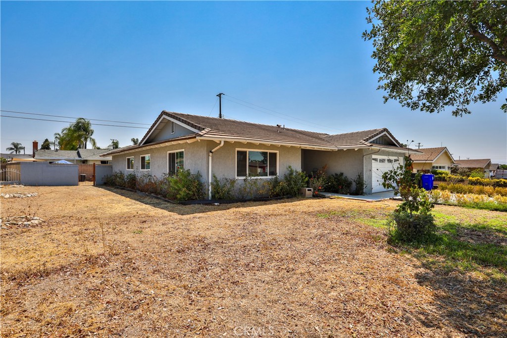 Welcome to this beautifully remodeled Single Story 4-bedroom, 2-bathroom pool home on a desirable corner lot. This inviting property blends modern elegance with thoughtful design, perfect for families and entertainers alike.
Recent upgrades include a tile roof, dual-pane windows, concrete driveway, luxury vinyl flooring, updated kitchen and bathrooms with new cabinets and quartz countertops, LED lighting, millwork, and new interior doors.
Step inside to an open floor plan connecting the living, dining, and family areas, creating a bright, airy feel. The remodeled kitchen features sleek white cabinetry, stainless steel appliances, and plenty of counter space. The cozy family room with a charming fireplace is perfect for cooler evenings, and large windows fill the home with natural light.
Outside, enjoy your private oasis with a sparkling pool and spacious backyard, ideal for summer gatherings. The attached garage provides convenient parking and storage.
This corner-lot treasure offers comfort, style, and functionality, ready for you to call it home.