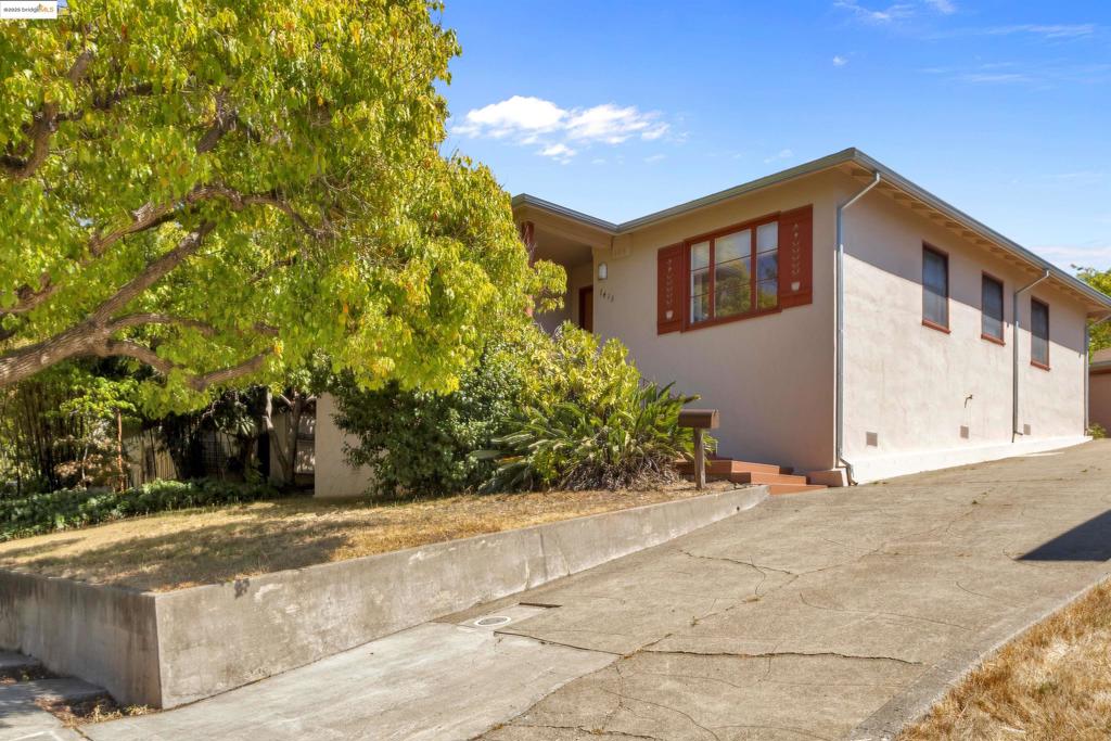 Welcome to 7415 Circle Hill Drive! Built in 1948, this charming home offers 1,290 square feet of living space with two bedrooms and 1.5 baths. Original details add warmth throughout, including hardwood floors that remain in excellent condition and simply need a little love to shine. The kitchen is original, with plenty of cabinetry and ready for your personal touch to make it your own. A true highlight is the versatile Accessory Dwelling Unit (ADU)—approximately 270 square feet—complete with a full bath, kitchenette and AC. Perfect for generating rental income, hosting guests, or creating a private retreat. Outdoors, the expansive 7,128 square-foot lot is graced with mature fruit trees and enhanced by unique bonus structures. Start your mornings in the whimsical folly, ideal for coffee, a private office, or a quiet retreat. The original shed still stands, offering storage or hobby space. Enjoy a backyard retreat like no other. For added convenience, a detached garage and shared driveway provide ample parking and extra functionality. This Oakland gem is full of potential—move in and enjoy its character, or update it to your taste and maximize its value. A wonderful opportunity for both homeowners and investors alike!