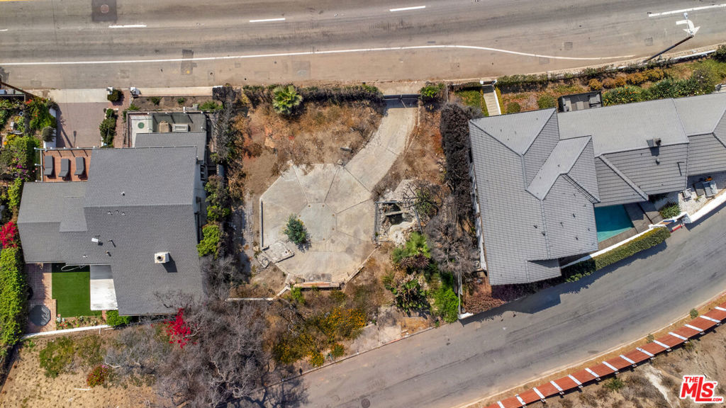 A truly rare opportunity to own and build along Malibu's legendary Pacific Coast Highway. This vacant expansive 6,700 SQFT lot offers sweeping, unobstructed views of the Pacific Ocean and coastline, creating a stunning backdrop for a future architectural masterpiece. Perfectly positioned between houses that didn't burn with direct beach access, the property blends convenience with the tranquility of coastal living. Whether you imagine a sleek modern estate or a timeless beach home, 21711 PCH provides the canvas to bring that vision to life. Few properties in Malibu present this level of potential at this price. An extraordinary investment in both land and lifestyle.