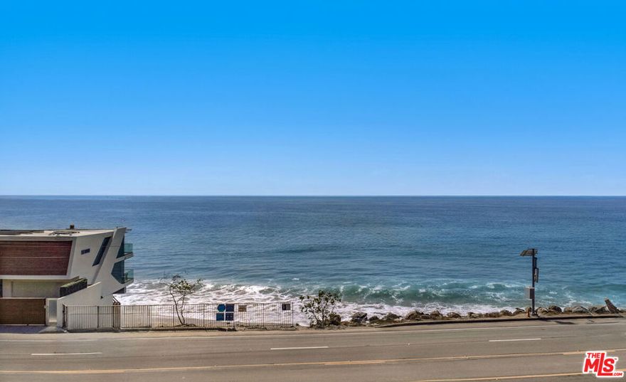 A truly rare opportunity to own and build along Malibu's legendary Pacific Coast Highway. This vacant expansive 6,700 SQFT lot offers sweeping, unobstructed views of the Pacific Ocean and coastline, creating a stunning backdrop for a future architectural masterpiece. Perfectly positioned between houses that didn't burn with direct beach access, the property blends convenience with the tranquility of coastal living. Whether you imagine a sleek modern estate or a timeless beach home, the septic is intact, recently cleaned, and capped. 21711 PCH provides the canvas to bring that vision to life. Few properties in Malibu present this level of potential at this price. An extraordinary investment in both land and lifestyle. *Former structure shown for reference only. Property currently consists of vacant land.*