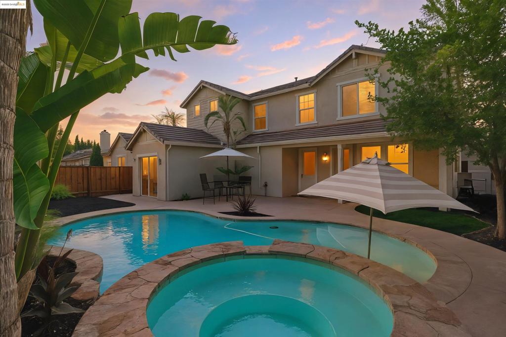 1st OPEN HOUSE SUNDAY 8/3 from 1-4pm Welcome to One of the Few Original Owner Homes in Lakeshore Gated Community! This beautifully maintained residence has been recently refreshed with new interior paint and flooring, offering a move-in-ready experience for its next proud owner. Designed with entertaining in mind, the backyard is an absolute dream—featuring a sparkling in-ground pool and spa, creating your own private oasis just in time for summer. The oversized 3-car garage includes a rare drive-through option, and with parking for up to 7 vehicles, there’s more than enough space for guests, toys, or a growing household. The home's charming curb appeal is enhanced by a stately wrought iron double gate entry and manicured landscaping. Lovingly cared for over the years, this home is not just a property—it’s a legacy. Located within the desirable Lakeshore community, residents enjoy access to a scenic lake, picnic areas, a basketball court, and peaceful walking trails. Don’t miss the opportunity to make this gem your forever home. Come relax poolside and enjoy all that Lakeshore living has to offer!