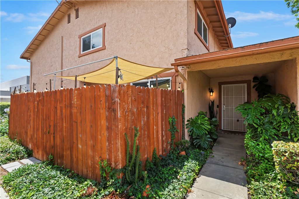 Welcome to this beautifully updated 2 bed, 1.5 bath end-unit condo in the heart of Corona -- where comfort, convenience, and lifestyle come together. Enjoy the privacy of your own attached garage plus an assigned parking space, all just steps from a wide greenbelt. Inside, the bright and airy layout features gorgeous laminate flooring, recessed lighting, and a spacious family room that opens to your private courtyard -- perfect for morning coffee or sunset vibes. The kitchen shines with quartz countertops, stainless steel appliances (yes, the fridge stays!), and custom hexagonal tile flooring, all flowing effortlessly into the dining area. Upstairs, you’ll find two generously sized bedrooms and a refreshed full bathroom with a modern vanity and lighting. The primary bedroom is spacious and serene, while the second bedroom makes a great guest room, nursery, or WFH setup. Tons of storage, too -- with a large under-stair bonus space, linen cabinet, and more. The pet-friendly community features lakefront paths where you can fish, relax by the water, or head out to the Skyline Trail for hiking or mountain biking. Amenities also include two pools, tennis courts, basketball, and more -- all just minutes from shopping, dining, and major freeways.