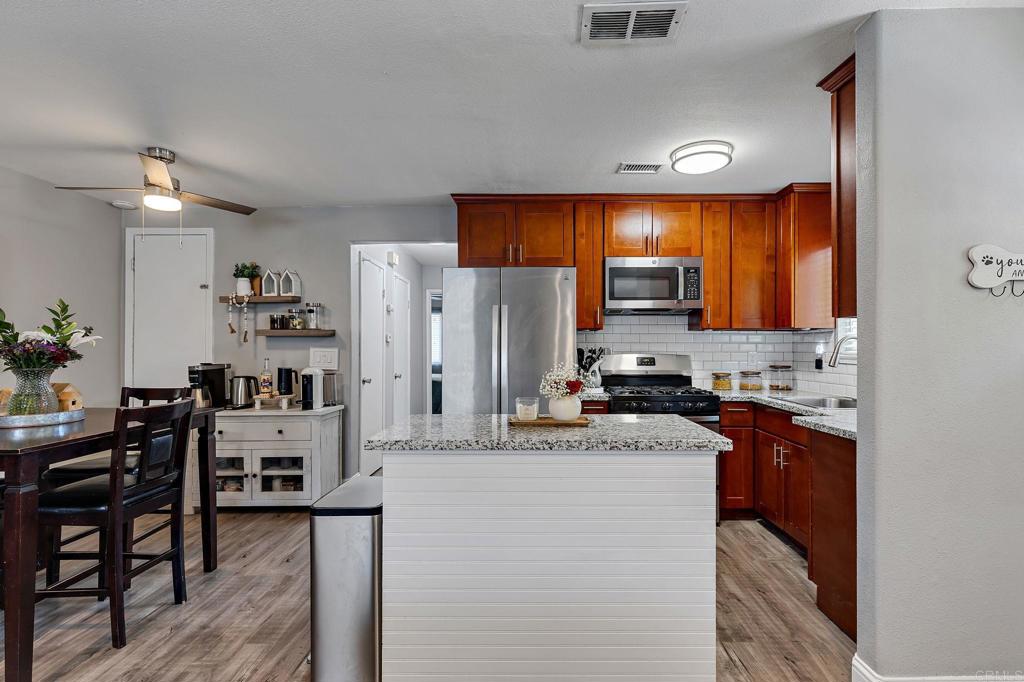 Welcome to this spacious and beautifully maintained 924 sq. ft. condominium, ideally located in the heart of Elk Grove. This home features two generously sized bedrooms, including a primary suite with a walk-in closet. The kitchen and bathroom have both been thoughtfully remodeled, offering modern finishes and functionality. The updated kitchen boasts granite countertops, stainless steel appliances, and a large center island that seamlessly connects to the open-concept living and dining areas—perfect for entertaining or everyday living. The bathroom includes a tiled shower/tub combination and an upgraded vanity. 2Additional highlights include newer flooring throughout and ample natural light. The HOA covers exterior maintenance of common areas, internet, cable, trash, and landscaping, providing both convenience and value.