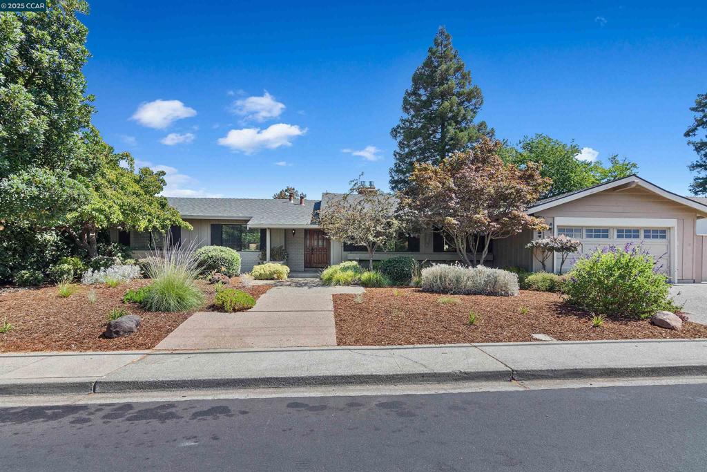 NORTHGATE NEW TO MARKET! 4-bedroom, 2-bath SINGLE STORY on a .22-acre lot with private backyard and lighted sport court. Hardwood floors, updated kitchen open to the family room, custom built-ins, two-way fireplace, and primary suite with slider to backyard deck. Updated baths, fresh paint, new bedroom carpet (2025) and new furnace & AC (2024), plus freshly landscaped front and back yards. Close to Walnut Acres Elementary, Foothill Middle, Rancho San Miguel and Scottsdale Swim Clubs, Canal Trail, and Ygnacio Valley Plaza shopping.