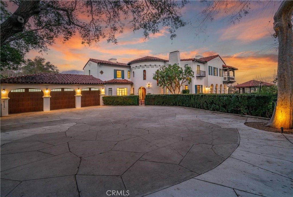 AMAZING VIEWS!! VIEWS! VIEWS! Nestled in one of Pasadena's most coveted areas, this spectacular Modern Spanish estate is an unbelievably special property masterfully blending modern luxury with old world Spanish charm. Enjoy sweeping views of Golf Course, the Rose Bowl, and the San Gabriel mountains. The beautiful foyer welcomes you with an elegant staircase, stained glass windows, and voluminous high ceilings. Spacious Living Room with Oversized Fireplace and priceless views are framed by stunning original wood beams. Soak in all of the Pasadena sunshine in the Sun Room with original Spanish tiles, Fireplace, and gorgeous arched windows. Modern Kitchen hosts stainless steel appliances and beautiful luxurious finishes. Ground Floor Office is tucked away for privacy with its own elegant design touches. All 5 Bedrooms have En Suite Bathrooms and Walk-In Closets. Primary Suite features custom Wood Wall Paneling, Fireplace, and its own spacious Patio overlooking the views. Master Bathroom feels like a spa getaway with dual sinks, standalone Bathtub, and oversized Shower. From the Master Bathroom, step into the grand Dressing Room with wall to wall custom fitted closet system. On the lower floor, further invigorate the senses with a moody lounge room, wet bar, surround sound system, and wine room. Outside enjoy the Gazebo with automatic weather proof coverings and the flat yard below. Approximately 7,000 sq ft of additional flat land in the back yard. Totally Remodeled in 2019, this extraordinary Modern Spanish residence is the perfect marriage of tranquility, thoughtful artistry, and luxury in the heart of Pasadena. Also, available for sale.