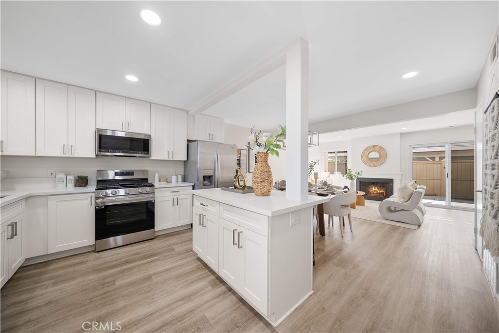 Gorgeous remodeled 3-bedrooms and 2-bathrooms townhouse with an open floor plan in the coveted Woodbridge Neighborhood. Brand new kitchen opens to the living and dining rooms with an island. The open living space brings in plenty of natural light from both sides of the building. One full bathroom upstairs with two doors can be accessed from the master bedroom and the hallway, another full bathroom is downstairs. Outside, the lovely courtyard is a great space for morning coffee or evening chats with your family or friends. The two-car detached carport is also right outside the fence and makes it easy to access the home after returning from work, school or shopping, and there is a good size storage room with door and lock in the backyard. Meadow Park Elementary School, South Lake Middle School, and Woodbridge High School are just within the walking distance. Woodbridge Village community has more than 20 pools, and many tennis courts with two beach lagoon pools and two beautiful lakes, shopping centers with movies, food, and entertaining activities for all ages. Since Woodbridge is located in the center of Irvine, you are close to the beach, John Wayne Airport, UCI, South Coast Plaza, The Spectrum, hospitals, as well as all the restaurants and shopping centers in the city.