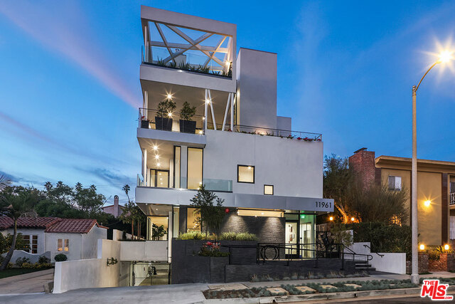 Spectacular single level 5 year new construction condo in the heart of Brentwood. Only 1 unit per floor with no shared walls. Direct elevator access leads to a large open versatile floor plan with gorgeous oak wood floors, floor to ceiling windows that flood natural light into the residence. Multiple living areas and exquisite bar area will allow the most discerning resident to create their own dream living space. Fully equipped gourmet kitchen with top of the line appliances. breakfast bar and walk-in pantry. Spacious primary bedroom suite features exquisite large walk in closets and double sided fireplace that open to the elegant en-suite bathroom with free standing soaking tub, large shower and dual sinks set in quartz counters. 2 Additional bedroom suites. Spa room with steam shower and separate yoga area. Enormous private front patio with breathtaking views. In home laundry/utility room with new washer and dryer. Gated parking with 3 single spaces.