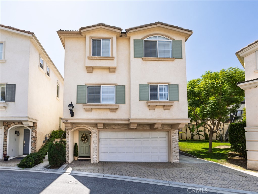 This beautifully maintained 3-bedroom, 2.5-bathroom detached patio home sits on a private, desirable block and features spacious living areas, high ceilings, and wood flooring. As you enter, you’ll be greeted by a split-level living room along with a half bathroom and a cozy gas fireplace, perfect for relaxing. Step outside to enjoy the private patio, offering a peaceful outdoor retreat. The huge dining area conveniently overlooks the living room, providing easy access to both the kitchen, family room, and living room. The kitchen features myriad cabinets, tile flooring, an island, gas oven, microwave, and dishwasher along with a large window providing plenty of natural light. The kitchen extends into the family room and dining room, providing a seamless flow throughout the main living areas. Upstairs, you’ll find all 3 bedrooms, 2 bathrooms, and the conveniently located laundry room. The main bedroom is complete with a walk-in closet and an en-suite bathroom featuring a dual vanity, abundant storage, a separate jetted tub and shower, and a private toilet area. Two sizable bedrooms overlook the private patio and share a large, full bathroom down the hallway. The home also features an attached, two-car garage, water softener, recessed lighting, and central air conditioning.