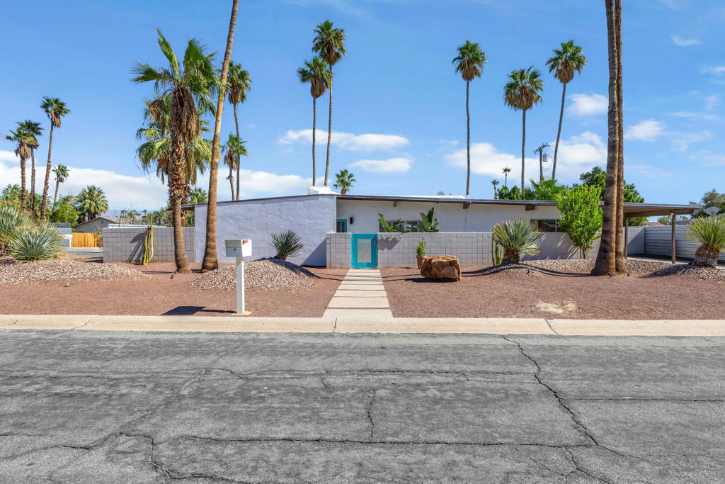 Welcome to 2250 E. Acacia Rd, an updated example of Desert Modernism, designed by Jack Meiselman. This serene Desert Park Estates home sits on a spacious corner lot allowing for breathtaking views of three mountain ranges. Step inside the low-slung home to discover signature details like an elegant floorplan, post-and-beam construction and butterfly roofs. The front of the home and living room with its high ceilings open to reveal the San Jacinto Mountains. The west-facing kitchen and dining areas overlook an expansive yard with multiple areas for entertaining and a magnificent pool and spa. The primary bedroom situated on the south side of the home is en-suite with direct access to the pool. The secondary bedrooms and full bathroom are on the opposite side of the home, a notable design feature of a Mid-Century Meiselman. The indoor spaces take full advantage of the outside areas and each seamlessly lights and shades throughout the day as the sun moves about the house. And thirteen mature palm trees dot the property to provide the perfect desert soundtrack when the winds blow. The pool and spa feature a new heater and have been recently drained and acid-washed and the electrical panel has been upgraded. The yard is framed by a mature hedge allowing for privacy, and Mid-Century Modern landscaping typical of a Meiselman.Meiselman worked with the Alexander Company then branched out offering his own designs. He and his brother Bernie built some 350 homes in Palm Springs. This notable example of Meiselman's work has been featured on the Palm Springs Modernism Week tour.