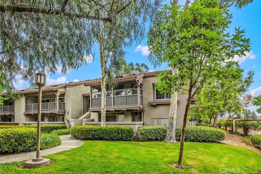 Located in the heart of Tustin Ranch, this beautifully updated upstairs end-unit condo features 2 spacious bedrooms and 2 full bathrooms. Freshly painted with brand-new carpet, the open floor plan is bright and welcoming. The modern kitchen includes quartz countertops, soft-close drawers and cabinets, and an electric range, seamlessly flowing into the living area—ideal for daily living or entertaining. Enjoy a private patio for morning coffee or evening relaxation. This home provides 2 garage spaces (Most only have 1), a newer water heater, and newer windows for improved energy efficiency. The well-maintained community offers 2 sparkling pools and access to award-winning schools. A rare turnkey opportunity in a highly desirable neighborhood!