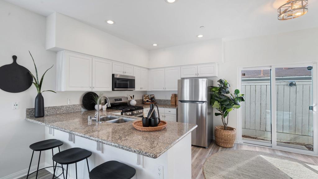 VA approved townhome with no HOA dues! This move in ready private end unit with modern updates is less than 2 miles from the beach. The kitchen features all brand new stainless steel appliances, with washer and dryer in unit and A two car attached garage with epoxy flooring offering ton's of storage. Enjoy a full fenced in outdoor area to either lounge or entertain. Close to the naval base, beaches, shops, and dining. This property qualifies for special financing. Contact to find out more!