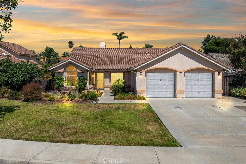 Discover coastal charm in this beautifully maintained single-level home located in the desirable Guajome Meadows community of Oceanside. Offering 4 bedrooms, 3 bathrooms, and 2,010 sq ft of living space on a spacious 10,170 sq ft lot, this home is ideal for relaxed California living. The open-concept layout features a modern kitchen with white appliances and a garden window, flowing seamlessly into the family and dining areas—perfect for entertaining or everyday life. Beautiful engineered wood flooring leads to the west wing, where you’ll find the primary suite with an ensuite bath, step-in shower, and walk-in closet, along with two additional bedrooms, a full hallway bath, and a convenient indoor laundry room. A cozy fireplace anchors the formal living room, creating a welcoming entry, and the 4th BEDROOM WITH PRIVATE BATH offers flexibility for guests, in-laws, or a home office. Outside, enjoy a low-maintenance backyard with space to BBQ, relax, or tinker in the accessory shed. The three-car garage includes built-in cabinets and a workbench for extra storage and projects. Built in 1996 and located just minutes from beaches, shopping, dining, and top-rated schools, this home offers the best of Oceanside living in a quiet, established neighborhood.