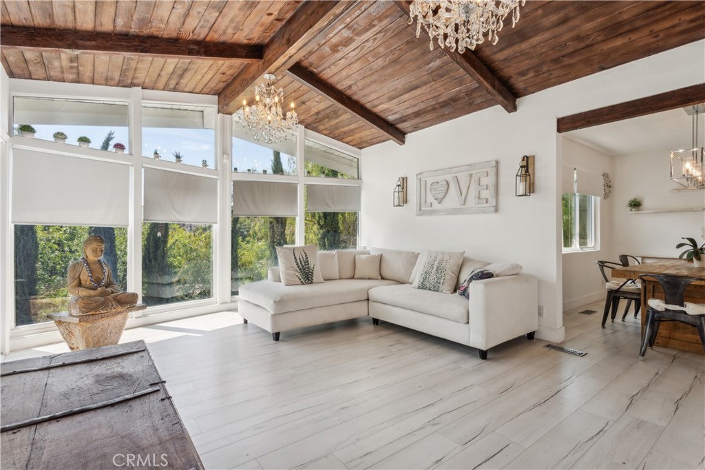 Stunning Mid-Century Gem in Woodland Hills — South of the Boulevard
Step into serenity in this gated hillside retreat, perfectly nestled in the lush, peaceful community of Woodland Hills. Surrounded by trees this South of the Boulevard 5 bedroom, 3 bathroom mid-century modern home offers the ideal blend of nature, privacy, and luxury. Behind double stained-glass doors, you'll find soaring beamed ceilings, skylights, white oak floors, and a spacious open-concept layout. The chef’s kitchen is outfitted with a Miele refrigerator, Viking stove, designer backsplash, new countertops, and a large island ideal for entertaining. Each bedroom opens to its own deck with sweeping hillside views, while the backyard features an above-ground pool, multiple lounge areas, and gated parking. Property can be leased furnished or unfurnished. Recent upgrades include a brand-new HVAC system (2025), new water heater (2024), fully paid solar panels, security system, water softener, and included Wi-Fi, gas, alarm, gardener, and pool service. Minutes from Trader Joe’s, Whole Foods, The Village, and the Woodland Hills Country Club.