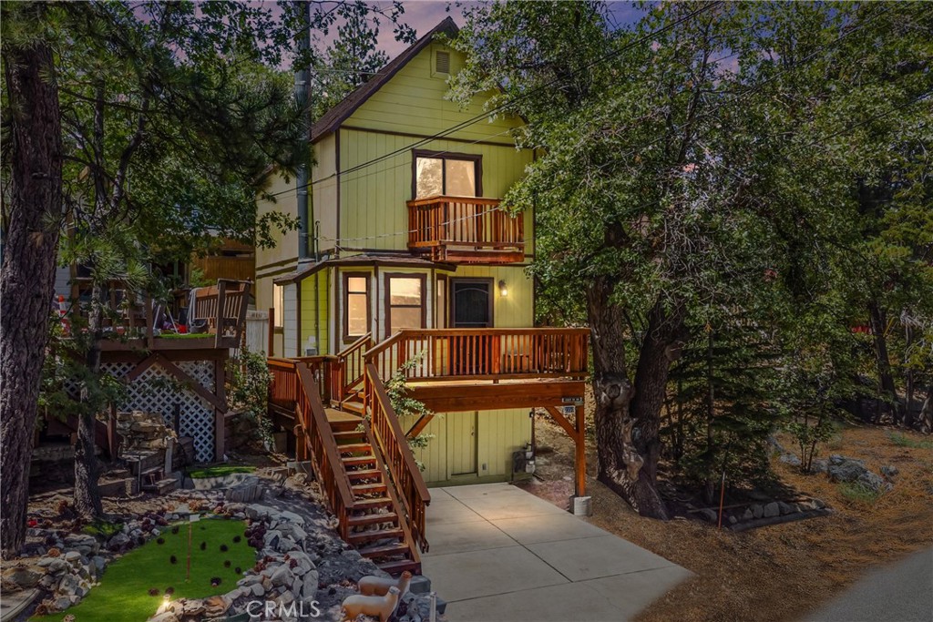 Cozy mountain retreat just 4 miles from Snow Valley Ski Resort! This charming 2-bedroom, 1-bath home is perfectly located near hiking trails and a tranquil lake, offering year-round outdoor enjoyment. Inside, you’ll love the updated kitchen with granite countertops, soft-close drawers, and stylish finishes. The bathroom features luxurious heated floors, while dual-pane windows, oak doors, wood floors, and a cozy fireplace add warmth and character throughout. The primary bedroom offers a private balcony with peaceful forest views—ideal for morning coffee or stargazing at night. Off-street parking in your own driveway adds convenience, and with easy access to Highways 18 & 330, you can enjoy a quick commute while feeling worlds away. Whether you’re looking for a weekend escape or a full-time home, this property delivers the best of mountain living