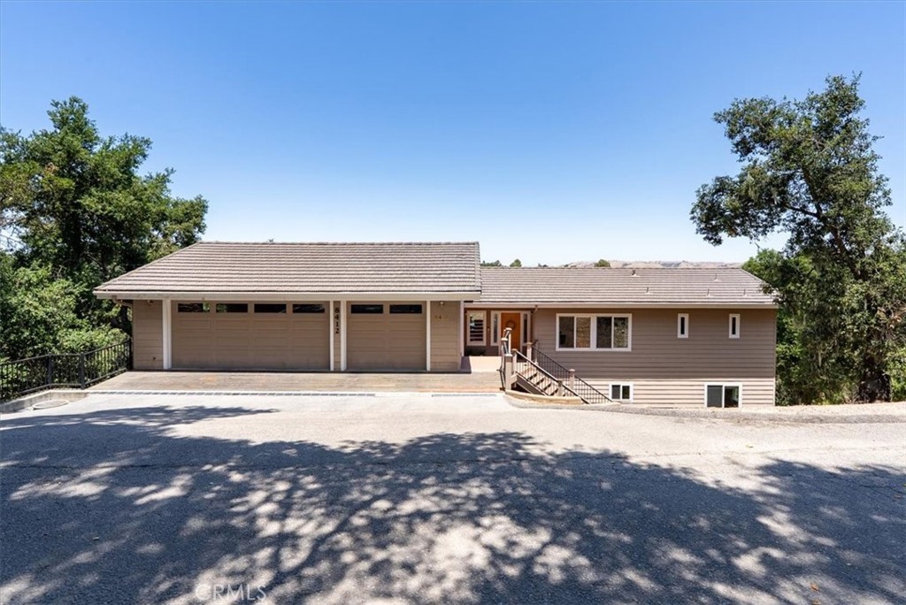 Beautiful custom home nestled amongst the Oaks with a great convenient location. True to its name 8412 Alta Vista (upper view) has wonderful views of the picturesque hills and expansive views of town. Only 4+/- minutes to Atascadero's vibrant Downtown. A serene setting in the hills located on a quaint tree-lined street. First time on the market. This is a quality custom home that includes durable Trex decks spanning the full length of both floors of the home. Wonderful views throughout. Ideal floor plan with a main floor that includes the primary bedroom suite, kitchen, large laundry room with exceptional storage, dining area and the living room with a fireplace. Downstairs you have the 2nd bedroom, 3rd bedroom suite, a corner office and a large living area. The living area includes a wet bar/mini fridge, bar counter and large storage closet. Multiple sliding doors on both floors make it easy to step out onto your hillside perch. Enjoy a fresh breeze, a view of City Hall/downtown, the hills near & far, and you can even catch a Greyhound (AHS) baseball game from your deck. Plenty of room in the full size 3 car garage and there is a large finished basement below the home (basement not included in the home sq.ft.). Come see this serene setting, the beautiful views and all within a short drive to Highway 101 & Downtown Atascadero. 8412 Alta Vista is well maintained and ready for you!