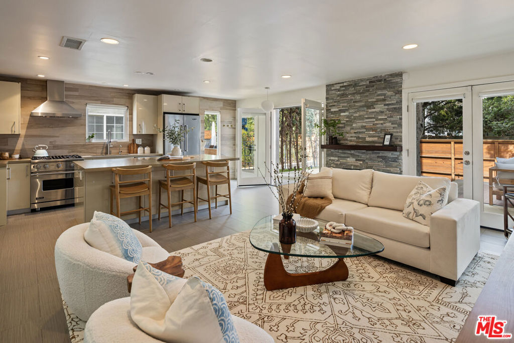 This one is all about living the actual dream. On a beach walk street, just steps to the sand sits this gated architectural duplex where all you really need is your toothbrush and maybe a surfboard. The stunning front unit has two bedrooms (the 2nd bedroom is currently used as an office/extension of the primary, with its own balcony), two and a half baths, and a fantastic floor with a free-flowing kitchen/living/dining room that opens onto the spacious and gracious patio, with room for more cooking, eating, and living. The upstairs back unit, with 2 bedrooms of its own, could be used as an extension of the home, a sort of built-in guest house, or as an income producer. And this location! You're in the middle of it all, but it still feels like a vacation. If you're exhausted from all of the entertaining you'll do because you've become the hub of your social circle with this swank pad, just pop around the corner and grab a bite at any of the fantastic restaurants on Washington Boulevard. You're close enough to stroll the Venice Canals and do some world-class shopping on Abbot Kinney. And the beach! You can catch the sunset every single evening. This one is more than a home, it's a lifestyle.
