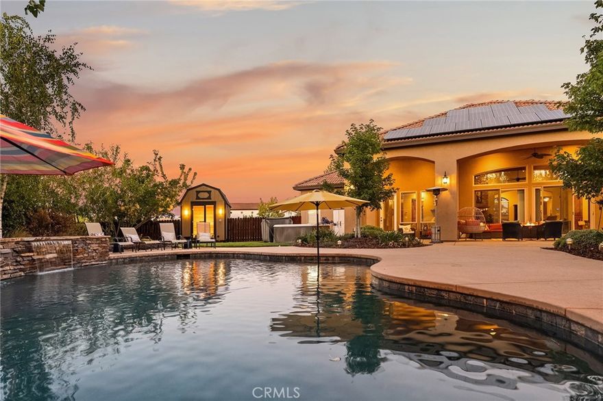 Your DREAM HOME awaits, in the prestigious Sierra Moon Subdivision! This luxurious Mediterranean-style home offers 4 bedrooms, 3 baths, and an expansive 3,264 sq ft of refined living space. Upon walking up to the home, you will be greeted by a massive rustic wood front door that opens up to a grand entryway with art niche. The open-concept design seamlessly connects the kitchen, dining, and great room, where rustic beamed ceilings and a dramatic stacked stone fireplace create a warm, inviting ambiance. The heart of the home is a gourmet chef’s kitchen featuring gorgeous granite countertops, all stainless-steel appliances, including a Kitchen Aid 6 burner gas stove! There is a large breakfast bar island, tons of prep space, and a massive walk-in pantry—perfect for entertaining or everyday culinary adventures. A private double-door study provides a quiet retreat, while the oversized laundry room offers abundant cabinetry and workspace. The split floor plan ensures privacy, with the Primary Suite and guest bed/bath on one side and two additional guest rooms with a shared bath on the other. You will love that the Primary Suite has quick access to the jacuzzi and pool area along with large walk-in closet, 2 separate vanities, oversized jacuzzi tub, and walk-in shower featuring 3 shower heads! Step outside to your PERSONAL RESORT: a sparkling pool with stacked rock waterfalls and umbrella-ready bench seating! Incredible outdoor kitchen with commercial-grade BBQ & hood, additional burners, flat top grill, sink, refrigerator, ice maker, with granite countertops creating 11 feet of full bar seating, and custom cabinetry. You won't believe the protective metal shutters and full sliding doors that will fully enclose & shield the whole space! Even a spot for your TV! Unwind in the 8-person Jacuzzi or huge 12 x 8 ft sauna that can hold up to 8 or 9 people! Certainly, a wellness center in your own backyard! Grow your own produce in the many raised garden beds conveniently hidden behind the kitchen. Don't forget the 36 panels of OWNED SOLAR to help with the bills!  RV enthusiasts will appreciate the dedicated parking area with hookups and dump station.  Need more room for more toys?  Just take a look through the privacy gate, which is neatly graveled and ready to house much more! There is ample storage in the additional 10x16 ft. shed beyond the garage. This home truly has something for everyone and offers an unparalleled lifestyle of comfort, luxury, and functionality.