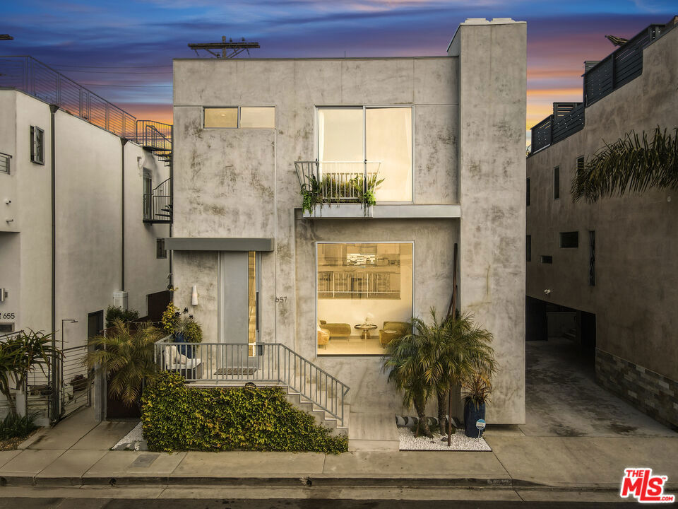 Nestled in the heart of Venice Beach's exclusive Silver Triangle neighborhood, this stunning contemporary singe family home + bonus living space offers the ultimate coastal lifestyle, just a moments stroll to the Venice Canals, Abbot Kinney, the Marina, and Venice Beach. Remodeled in 2025, this turn-key residence blends modern elegance and sophistication, with a relaxed, beachy vibe. The main house boasts a light-filled, open-concept design with vaulted ceilings, and floor-to-ceiling windows that welcome an abundance of natural light. Featuring polished designer concrete, bamboo wood flooring, and custom wool stair runners, the thoughtfully designed layout spans multiple levels, offering an airy loft-like feel. The sleek, modern kitchen, remodeled in 2025, flows seamlessly into the spacious dining and living areas, perfect for entertaining, with a cozy fireplace. The expansive primary suite includes a luxurious en-suite bathroom with an oversized shower and tub, his & hers walk in closets, and an additional fireplace. A spiral staircase leads to the highlight of the home--an incredible fully finished rooftop deck with breathtaking panoramic city views, a peek of the ocean, and plenty of space for lounging, dining, and enjoying Venice's iconic sunsets (a new roof was added 2024). The outdoor space includes a hot outdoor shower, and a cozy garden with a gas BBQ. In total the home includes 4 bedroom, 3 full baths, and 2 half baths. This versatile property is currently configured to offer a 1 bedroom, 1.5 bath separated portion of the home, with its own entrance, and has an additional 400 SF of functional living space inclusive of a second kitchen. Whether used as a private in-law suite, a home office, a rental opportunity, a media room, or simply as an expansion of the main living area, this space offers incredible flexibility to fit a variety of lifestyles. Situated in a quiet residential enclave just four blocks from the sand, this home offers the perfect balance of tranquility and walkability, yet with all of the vibrancy of Venice minutes away- walk to the Venice Canals, Abbott Kinney, the beach, and all the Marina has to offer. World-class dining, shopping, and entertainment are all at your fingertips. Also available for sale - contact LA 1 for more information.