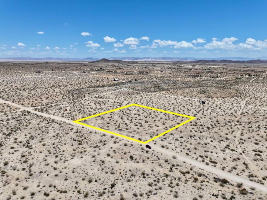 Owner May Carry Financing Available! Discover your desert dream on this beautiful 2.3 acre parcel located in the sought-after Hidden River neighborhood of Joshua Tree. Surrounded by natural beauty and high-end desert homes, this property offers panoramic views, star-filled skies, and peaceful seclusion. All just minutes from town and Joshua Tree National Park. Situated on a quiet road with direct access, this lot is ready for your vision. Power and water are nearby on Aberdeen (buyer to verify), making it ideal for a custom home, vacation rental, or designer compound. The gently sloping terrain is dotted with native flora including creosote, cholla, and desert yuccas, creating a pristine canvas for your high desert hideaway. Horse property. Only 17 minutes to the west entrance of Joshua Tree National Park which sees about 3 million visitors annually. 18 minutes to all amenities in Yucca Valley. 55 minutes to Palm Springs. This zip code is rapidly becoming one of Southern California's most in-demand destinations for artists, musicians, and investors. More celebrities are calling Joshua Tree home than ever before. Zoning may allow for a home and guest home. Buyers must contact the county planners with all questions on building and uses. Buyers must contact the appropriate utilities agencies with all questions on utilities. Lot size may vary slightly, buyer must investigate. APN: 0599-281-07-0000 GPS: 34.19548, -116.30648 Address is for marketing purposes only and is not an assigned address.