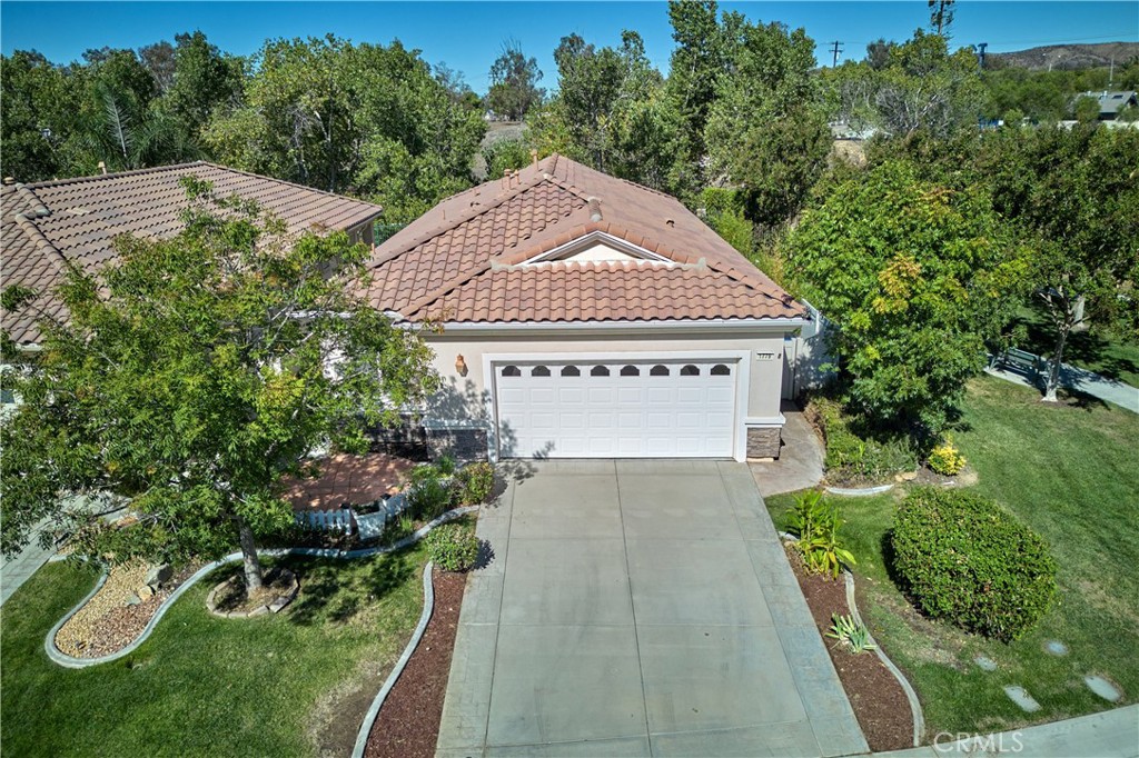 This charming Princess home sits on a very private lot with no homes behind and a small park right next door. Enjoy the beautiful covered back patio that feels like an outdoor living room — great for morning coffee or relaxing evenings. Inside, you’ll love the mountain views from the living room, which has wood laminate floors, and a custom corner fireplace. The dining area has tile flooring, and the den/office features new carpet. All appliances are included. Two car garage with plenty of storage space. A wonderful place to call home! The Solera 55+ community has a pool, spa, clubhouse, indoor gym, indoor walking track, tennis courts, billiards, meeting and banquet rooms, bocce ball, mailroom, library, classes, clubs, group trips and excellent 24-hour security. Basic Spectrum cable and internet are included with your HOA. Solera is close to Palm Springs, Redlands, the scenic mountain town of Oak Glen, Cabazon Outlet Malls, Morongo Casino and the best golf courses around. Solera is also preferred to the other Beaumont 55+ communities because of close, easier freeway access. Beaumont has a small town feel but with access to all there is to see and do in beautiful Southern California.