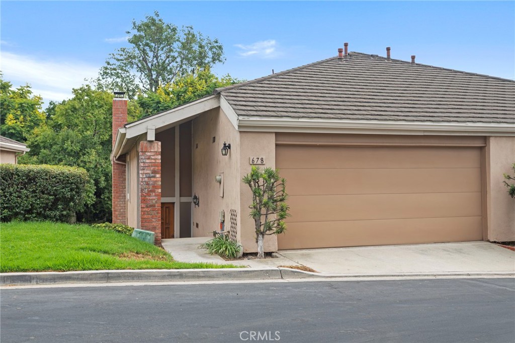 Don't miss out on this attached single-family, end-unit home that's located near the rear of the Glenwood Community. You'll want to come and see this updated kitchen with all new stainless appliances including electric range, microwave oven, dishwasher, and bottom freezer French door refrigerator! Kitchen also has a walk-in pantry and plenty of storage. This home features a cozy downstairs living room with a fireplace, separate dining area, a half bathroom and a covered back patio which has direct access to enjoy the beautifully maintained community greenbelt that's accessible just a few steps out of your back patio. Upstairs boasts 3 great-sized bedrooms along with direct access two car garage that has storage options available. The main bedroom showcases a view of the greenbelt and backyard patio, a spacious walk-in closet along with a mirrored closet, and double sinks in the expansive en-suite main bathroom. The laundry hookups are located inside the home, just off the kitchen in their own dedicated room. You're not too far from shopping, grocery stores, award-winning schools like Golden Hill Elementary and Sunny Hills High School, and all the additional benefits that Downtown Fullerton has to offer. The Glenwood community has its own well-maintained greenbelt and community pool for you to enjoy!
