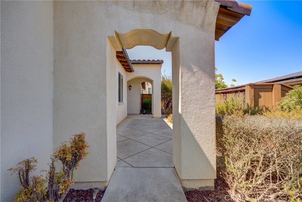 Welcome to 5765 Oak Pass Lane, Orcutt — nestled in the highly sought-after Rice Ranch community!
This elegant single-level residence, built in 2008, offers 3 spacious bedrooms, 2 bathrooms, and 1,892 square feet of thoughtfully designed living space on a beautifully landscaped 6,534 sq ft lot.
From the moment you enter, you’re greeted by soaring ceilings, 10-foot doors, and an open-concept floorplan that exudes sophistication and comfort. A welcoming entry with a coat closet sets the tone, while the living room features a custom oak built-in bookcase and a warm stone tile fireplace, perfect for cozy evenings or refined gatherings.
The expansive chef’s kitchen is a standout—complete with a large center island ideal for barstool seating, granite countertops, oak cabinetry, stylish tile backsplash, white appliances, and a double ceramic sink. It seamlessly flows into the dining area, where sliding glass doors open to a tranquil, private backyard oasis.
The serene primary suite is tucked away for privacy and indulgence. It features a generous walk-in closet, a second additional closet, and a private slider to the backyard retreat. The spa-inspired en-suite bathroom showcases dual vanities, a deep soaking tub, a walk-in shower, and a private toilet closet—your personal sanctuary.
On the opposite wing, two additional bedrooms are accompanied by a well-appointed hall bath, featuring a walk-in shower with seating, tile countertops, and matching oak cabinetry. A full indoor laundry room with a sink and ample storage adds ease and convenience.
Outside, the fully fenced and landscaped backyard is a low-maintenance paradise—with elegant pavers, mature olive tree, and space designed for effortless entertaining.
Additional features include a two-car garage, water softener system, and access to Rice Ranch’s renowned walking trails and parks. Enjoy the lifestyle of comfort, elegance, and Central Coast charm—just minutes from acclaimed dining, wineries, and historic Old Town Orcutt.