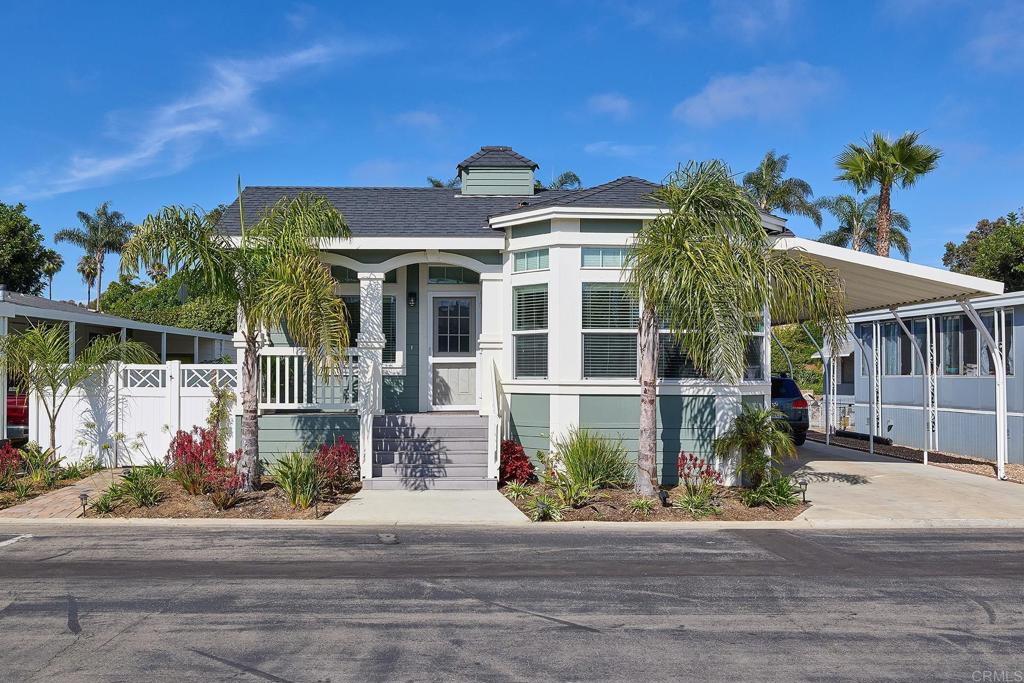 Stunning curb appeal and conveniently located in the exclusive 55+ gated community of Lakeshore Gardens! Beautiful 2015 build boasts serene front porch for enjoying morning coffee, an open floor plan with a spacious kitchen and breakfast nook, a generously sized primary bedroom with walk-in closet plus two additional bedrooms, one perfect as an office or den, an interior laundry room, and a large storage shed. Vinyl-fenced side yard with new, carefully chosen landscape and fountain offers privacy and zen, just outside your door. Lakeshore Gardens amenities include various recreational activities, including a library, pool, spa, sauna, fitness center, fireplace, and firepit for gathering, a clubhouse and more! The best part? No property taxes! Close in proximity to Carlsbad beaches, shopping, restaurants, freeway, medical services and more. Don't miss this fabulous home!