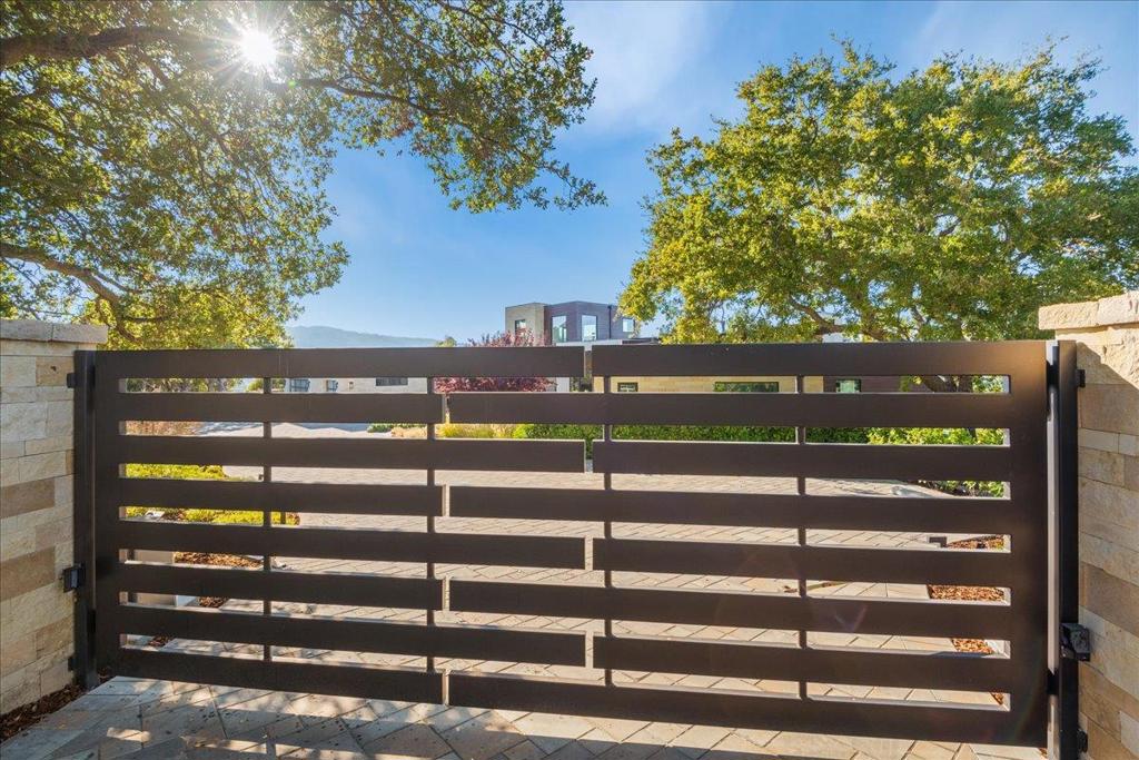 One of Kind Silicon Valley Modern View Estate in Los Gatos*A modern architectural masterpiece of epic proportions set in one of most prestigious neighborhoods in Los Gatos, Ca*The precision of the construction, the material used, and the level of finishes are unparalleled*A three-year construction collaboration was led by Massei Construction as the custom home builder, Gary Kohlsaat and Associates are the world class architects, David Fox is the landscape designer, and Douglas Landscape Construction implemented the hardscape and landscape*This 2.87-acre city light view estate offers 5 exquisite suites all on the ground floor, a stunning formal office/library, five- and one-half exquisite bathrooms, approximately 5,680 SQFT, four fireplaces, 3 car garage, infinity edged designer pool, spa, and views to downtown San Francisco, Oakland, and San Jose*This rare modern estate has 270-degree panoramic views that open to the Silicon Valley making a smooth transition from the privacy indoors to outdoor expansive views*Enjoy 50+ mile views to San Francisco including the Golden Gate Bridge* Incredible scale and unrivaled quality all in one of the most exceptional settings in Northern California*The absolute finest selection of materials & finishes have been used on this estate*Spectacular!