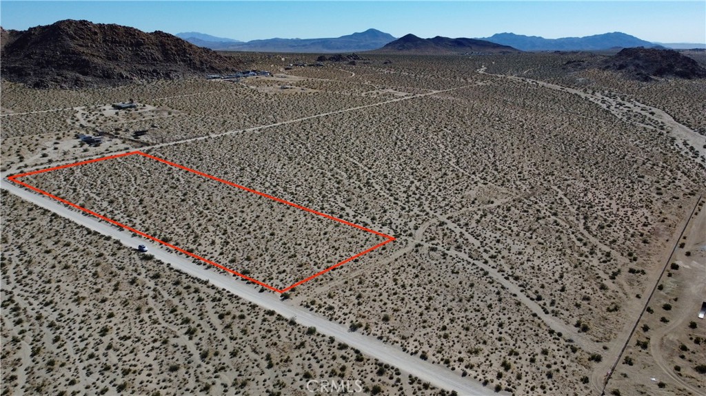 Five acres of wide open desert with mountain views so good you’ll feel like you accidentally wandered into a postcard. Located on the east side of Lucerne Valley, you’re a stone’s throw from Cougar Buttes, Soggy Dry Lake, and only about 20 minutes from King of the Hammers. Utilities are out there, just not nearby, but that just means you can set up camp, light a fire, and pretend you’re starring in your own desert survival show...minus the actual danger. Swing by, check out the views, and picture where you’d set up camp!
This property does not have an address assigned. "777 Peffer Ln" is for listing purposes only.
APN# 0449-541-53-0000
Coordinates:34.456907 / -116.796650
