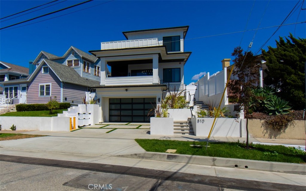 Welcome to a stunning new construction Craftsman masterpiece in the heart of prestigious South Redondo Beach. Spanning 4,319 square feet across three levels, this home offers 5 bedrooms and 7 bathrooms, thoughtfully designed with modern elegance and timeless craftsmanship. Step inside and be greeted by chic flooring, custom design details, and beautiful chandeliers that set the tone for refined coastal living. The elevator provides effortless access to all levels, including a rooftop deck with panoramic views of the Pacific Ocean and coastline. The gourmet kitchen is a chef’s dream, featuring a spacious pantry, large island, and Thermador appliances, perfectly paired with custom cabinetry and built-in Sonos speakers for seamless entertaining. Each bedroom enjoys its own dedicated bathroom and custom-built closets, while the luxurious primary suite boasts a spa-inspired bathroom with a soaking tub, dual vanities, and a walk-in closet with custom drawers. Enjoy cozy evenings by chic fireplaces or relax in the 3rd-floor living room and kitchen with breathtaking coastal views. Modern conveniences include central air and heating, paid-in-full solar panels, and impeccable design details throughout. This home is more than just a residence—it’s a statement of luxury, comfort, and California coastal lifestyle.