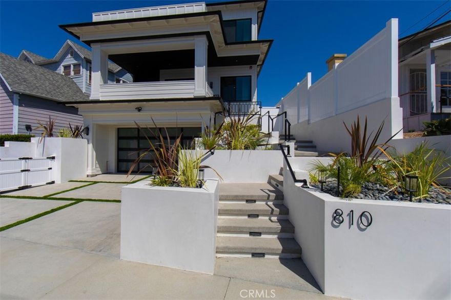 Just Reduced!!! Stunning new construction Craftsman masterpiece in the heart of prestigious South Redondo Beach. Spanning 4,319 square feet across three levels, this home offers 5 bedrooms and 7 bathrooms, thoughtfully designed with modern elegance and timeless craftsmanship. Step inside and be greeted by chic flooring, custom design details, and beautiful chandeliers that set the tone for refined coastal living. The elevator provides effortless access to all levels, including a rooftop deck with panoramic views of the Pacific Ocean and coastline. The gourmet kitchen is a chef’s dream, featuring a spacious pantry, large island, and Thermador appliances, perfectly paired with custom cabinetry and built-in ceiling speakers for seamless entertaining. Each bedroom enjoys its own dedicated bathroom and custom-built closets, while the luxurious primary suite boasts a spa-inspired bathroom with a soaking tub, dual vanities, and a walk-in closet with custom drawers. Enjoy cozy evenings by chic fireplaces or relax in the 3rd-floor living room and kitchen with breathtaking coastal views. Modern conveniences include central air and heating, paid-in-full solar panels, and impeccable design details throughout. This home is more than just a residence—it’s a statement of luxury, comfort, and California coastal lifestyle.