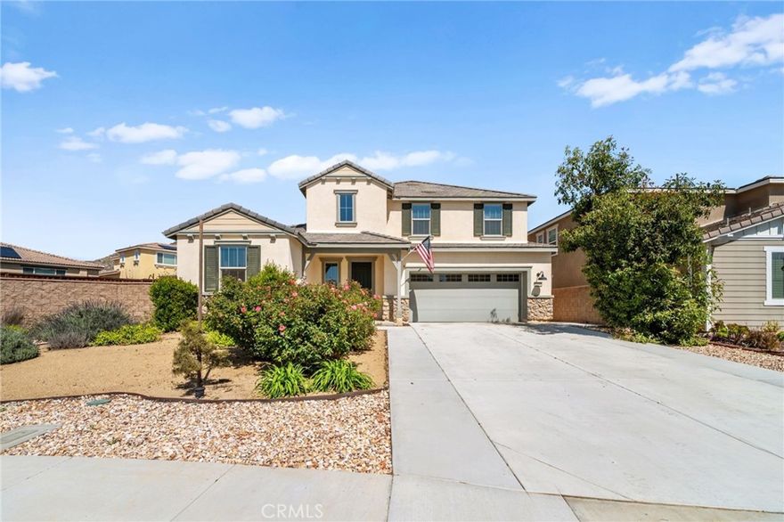 Welcome to your dream home in the prestigious Heritage Lake community of Menifee! Tucked away at the end of a peaceful cul-de-sac, this beautifully upgraded home offers one of the largest lots in the neighborhood, providing exceptional space, privacy, and versatility. Upon entering, you are greeted by a grand formal entry with soaring two-story ceilings and an abundance of natural light. The open-concept floor plan creates a warm and inviting atmosphere that flows seamlessly throughout the home. At the heart of the home is a stunning gourmet kitchen, featuring high-end stainless-steel appliances, a spacious center island, double ovens, a built-in range, and a walk-in pantry. This space effortlessly connects to the dining area and family room, creating the perfect environment for both entertaining and relaxing with loved ones. The thoughtfully designed floor-plan includes a full bedroom and bathroom on the main level, ideal for guests or multi-generational living. Upstairs, you'll discover a spacious loft, two additional bedrooms, a full bathroom, and a well-appointed laundry room with ample storage. The large primary suite features mountain views and a relaxing, spa-inspired bathroom with a walk-in shower, soaking tub, dual sinks, and a walk-in closet. The backyard is built for entertaining, featuring stamped concrete, a full-length Alumna-wood patio cover with ceiling fans, and plenty of space to add a pool, outdoor kitchen, sports court, or anything your imagination can envision. Additional highlights include a whole-house WiFi WAP system for seamless connectivity, energy-efficient solar panels, a Quiet-Cool attic fan, and a direct-access garage with built-in shelving for added convenience. The home is also enhanced with gorgeous new luxury vinyl plank flooring and modern fixtures throughout. Enjoy the many resort-style amenities of Heritage Lake, including a private 25-acre lake with paddle boats and catch-and-release fishing, two Jr. Olympic-sized pools, a splash pad, multiple playgrounds, sport courts, a fitness trail with outdoor exercise equipment, a rentable clubhouse, and year-round community events. You'll love the peaceful setting and the close proximity to shopping, dining, schools, and easy freeway access. This home offers an incredible blend of space, style, and an unbeatable lifestyle!