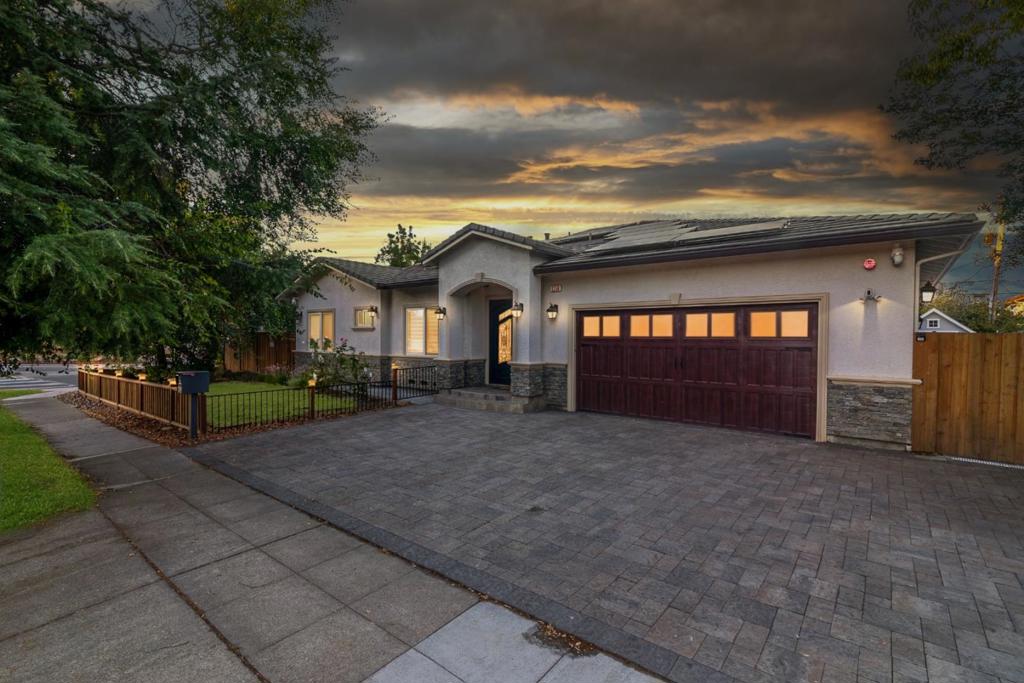 Live stylishly in Silicon Valley! This beautifully renovated single-story home offers 4 spacious bedrooms, 4.5 modern bathrooms (each equipped with a bidet) and a bonus office for added flexibility, was remodeled in 2019 (95% complete renovation), blending modern luxury effortless comfort. Enjoy 2,635 sq. ft. of open living space (buyer to verify) on a generous 9,276 sq. ft. lot, featuring high ceilings, elegant crown molding, and ensuite baths in every bedroom. The gourmet kitchen flows into bright living and dining areas, perfect for hosting. Outside, this corner lot property provides a decorative stone facade, roomy driveway for 4 vehicles, RV parking, and a 2-car garage deliver everyday convenience. The peaceful backyard, with mature lemon and orange trees, invites relaxation. Sustainable living supported by a 20 KW solar system - grandfathered under NEM 2.0, can power most or all household energy needs, plus two EVs. Prime location near apple HQ, shopping, parks, and top-rated Cupertino schools-Lincoln, Kennedy, Monte Vista. This home checks all the boxes: smart, stylish, and brilliantly located!