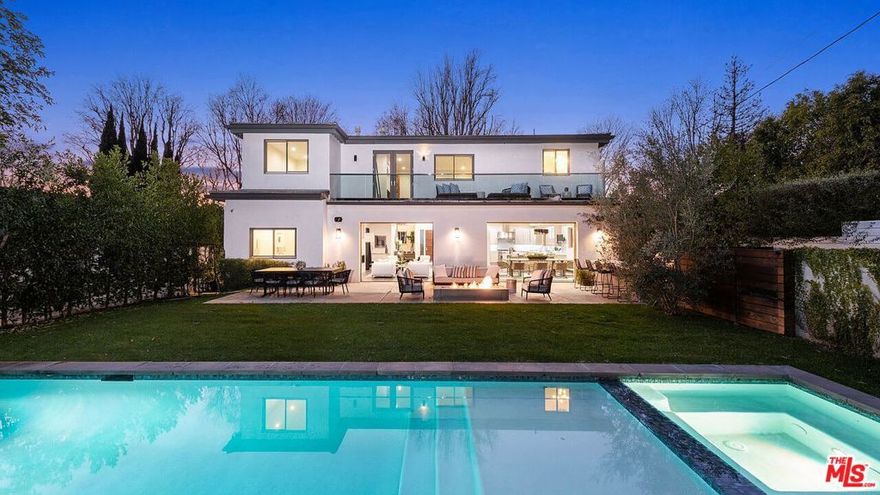 Large 10,200sqft Lot, 2021 custom build, nestled in the heart of Beverlywood HOA, just minutes from Beverly Hills, this stunning new construction contemporary home captures the essence of California living. Boasting 6 bedrooms, 7 bathrooms, and 5,800 square feet of meticulously designed living space, this home blends modern sophistication with effortless comfort.The grand entryway, with soaring ceilings, leads to an inviting family room, elegant dining area, and a state-of-the-art chef's kitchen featuring an oversized island and premium appliances, perfect for entertaining. Disappearing sliders in the main living area open to a private backyard oasis with a sparkling pool, waterfall, jacuzzi, fire-pit, and a built-in BBQ kitchen, creating a seamless indoor-outdoor lifestyle.Upstairs, the luxurious owner's suite offers a fireplace, walk-in closet, spa-inspired bathroom, and a balcony overlooking the lush backyard. Each guest bedroom includes en-suite bathrooms and walk-in closets, ensuring comfort and privacy throughout