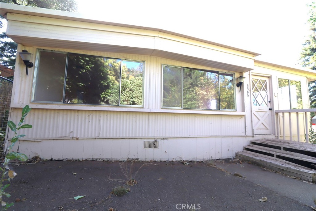 Endless Opportunity with access to Clearlake. This property presents a unique opportunity for investors or those seeking a multi-unit living arrangements. Situated on a large, completely fenced lot, the property features 3 separate units and 2 car garage. The primary resident features 2 bd, 1,600 sqft, boasting an open floor plan with an additional sun room. The detached 1-bedroom/ 1-bathroom unit, given some vision and renovation, could provide optimal rental potential, with the second detached unit functioning as a studio. 2 car garage provides ample storage. Bring your water toy, this property is complete with access to the lake and just minutes from Clearlake State Park!! Lake access is just a few feet away, so grab your fishing pole and meander down to the pier. Conveniently located approximately 2hrs from San Francisco or Sacramento, Kelseyville, features local wineries and shopping, with grocery, hospitals and other amenities located just minutes away.