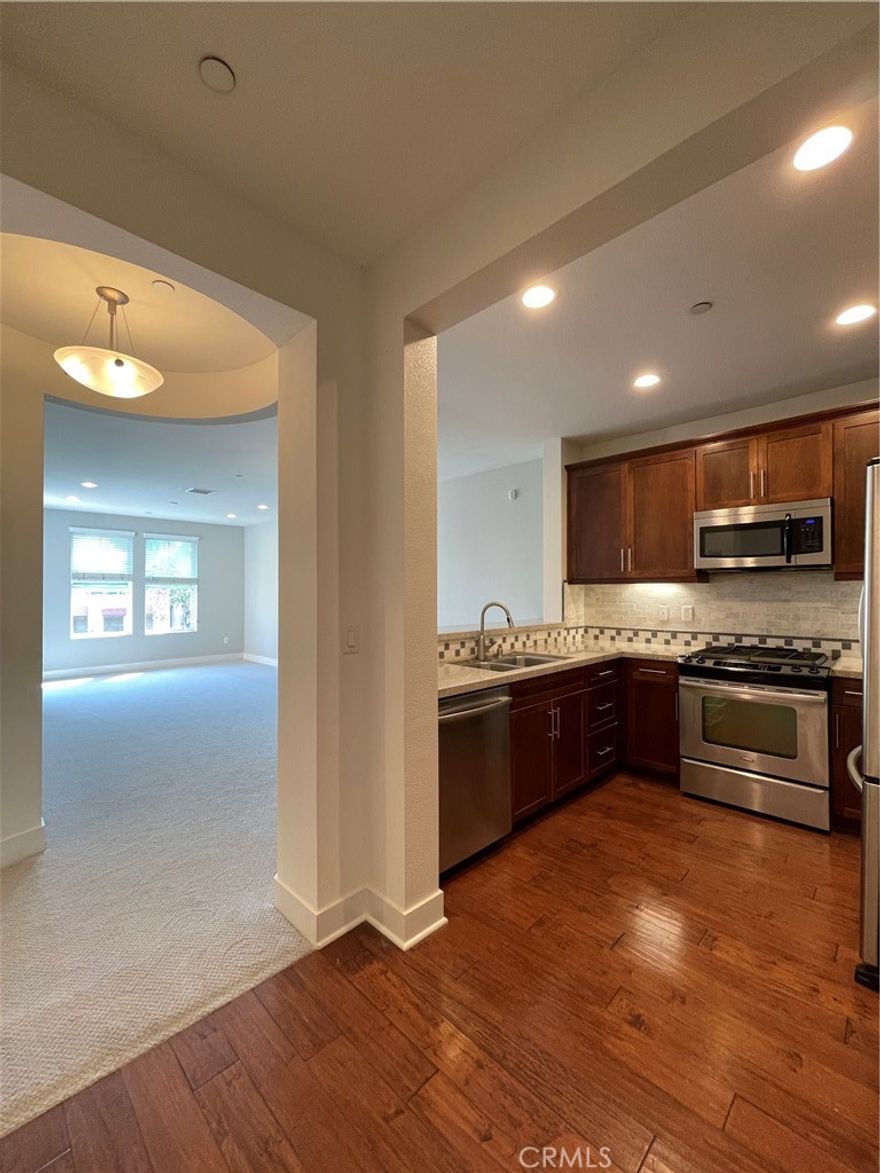 Discover your private oasis at "The Foundry," a tropical resort-style gated community right in the heart of Torrance. This modern and elegant top-floor condo offers one of the best locations in the community. Step inside and immediately feel at home in the bright, sun-drenched living room, which features recessed lighting and direct access to a private balcony. It's the perfect spot to enjoy your morning coffee while overlooking the stunning, lush courtyard. The open kitchen is beautifully appointed with granite countertops and stainless steel appliances, including a refrigerator and brand-new gas oven, making it a joy to cook and entertain in. When it’s time to unwind, your spacious master suite awaits, offering a large walk-in closet and even a bonus closet for extra storage. Convenience is key with an in-unit laundry closet, two side-by-side parking spaces (#139, #140), and two storage units. Plus, enjoy peace of mind as the HOA dues cover gas, water, and trash.



This isn't just a home; it's a lifestyle. "The Foundry" pampers its residents with a sparkling pool and spa, a stylish patio lounge with an outdoor fireplace, BBQ areas, and cabanas. Your new home is also perfectly situated. Leave the car and walk to Wilson Park to enjoy its sports complex, tennis courts, and the vibrant local farmer's market twice a week. Come experience this perfect blend of luxury, convenience, and resort living!