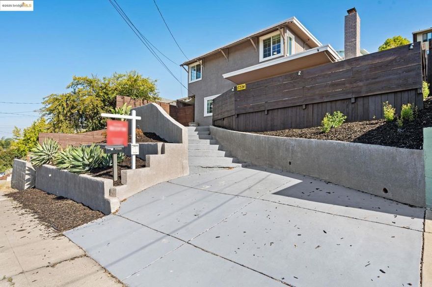 This stylishly updated 4-bedroom, 2-bath home blends comfort, functionality, and fresh modern design. Inside, you’ll find an inviting layout with gleaming hardwood floors, a contemporary kitchen with sleek finishes and stainless steel appliances, and two beautifully remodeled bathrooms. Large windows bring in natural light and hillside views, while the spacious backyard offers room to relax, entertain, or garden. A large storage shed with windows adds extra versatility—perfect for a workshop, studio, or bonus storage. With thoughtful updates throughout and a layout that lives large, this home is move-in ready and full of charm. Conveniently located near schools, parks, shopping, dining, and commute routes, it checks all the boxes.