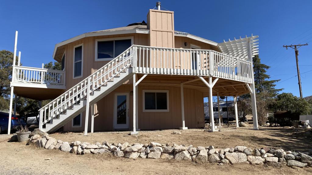 This unique 2 story Eagle Nest design home sits on 1 acre lot plus 2 additional acres included in the sale. Features an awesome wraparound deck on the second story that lets you enjoy either from inside or outside, the fabulous panoramic views. Second floor features master bedroom and a guest bedroom both with glass sliding doors and two full bathrooms. Downstairs includes 2 additional rooms another guest bedroom and bathroom. Don't wait make this property your very own heaven in the mountains!