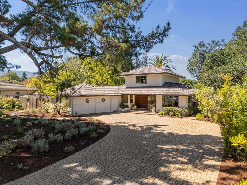Welcome to an exceptional home in one of the most desirable streets in North Los Altos. The large entry foyer, with a beautiful hard wood floor and hints of mid century modern design, leads to the formal living and dining rooms that opens to a covered patio and a huge private yard. The beautifully updated kitchen has high-end appliances, custom maple cabinetry, and granite countertops. The primary suite has multiple closets and a corner window with a beautiful view of the backyard. The adjacent bedroom upstairs can be used as an office or small childs bedroom; or combined with the primary bedroom to make a grand primary suite. The three downstairs bedrooms - one in the front and two in the back, are served by a large bathroom with a spa tub. The large lot offers endless possibilities for expansion or creating your dream estate in one of the most desirable streets of Los Altos.