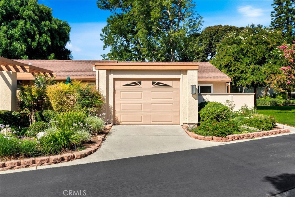 Come enjoy this luxury remodel of the rare La Princesa floor plan, ideally situated in a quiet end-unit location with serene greenbelt views. This one-bedroom, one-bath single-story home was fully upgraded in 2023 with a modern open-concept design. The kitchen flows seamlessly into the dining area with a waterfall-edge island, bold marble accents, and direct access to the patio — perfect for entertaining. Skylights in both the kitchen and bathroom fill the home with natural light, while upgrades such as double-pane windows, an energy-efficient heat pump, and full-size side-by-side laundry provide everyday comfort and efficiency. The living room opens directly onto a spacious lawn, and the tiled patio with adjustable sun shade creates an ideal indoor-outdoor lifestyle. The bathroom has been transformed into a spa-inspired retreat with a custom vanity and a walk-in shower wrapped in striking aqua-toned stone. Additional highlights include wide-plank flooring, recessed lighting, and thoughtful details throughout, making this home truly move-in ready. Residents of Laguna Woods Village (55+) enjoy unmatched resort-style amenities: 7 clubhouses including a Performing Arts Center, a world-class golf clubhouse with 27 holes plus a Par-3 executive course, 5 swimming pools, 4 hot tubs, lighted tennis and pickleball courts, full equestrian center, multiple state-of-the-art fitness facilities, art and hobby studios, and more. With free local bus service, scenic walking paths, and a location just several miles from Laguna Beach, this home offers the best of Southern California’s active lifestyle.