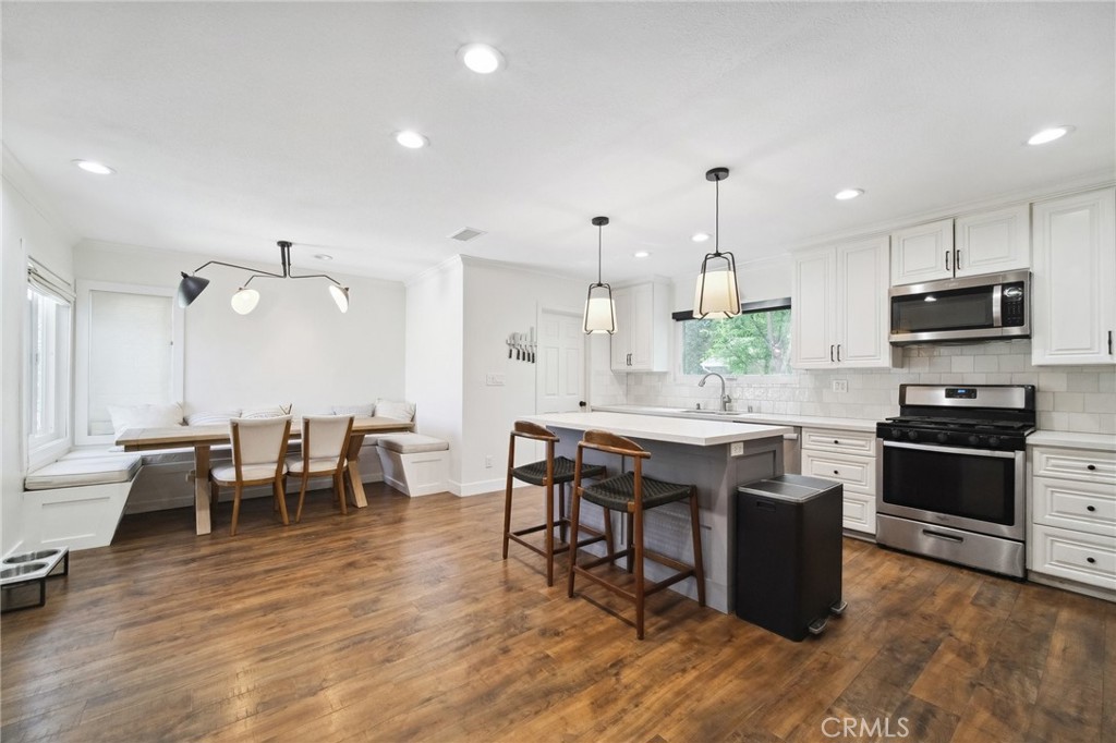 Chic and turnkey, this stylish single-story home in prime Tarzana—South of Victory Blvd—offers exceptional space, quality, and comfort. The open-concept floor plan includes a sun-filled living room addition, giving this home more interior space than many neighboring properties. The renovated kitchen features quartz countertops, stainless steel appliances, custom cabinetry, a center island with bar seating, and a built-in dining nook perfect for casual meals.
Enjoy seamless indoor-outdoor living with French doors that lead to a beautifully landscaped backyard, complete with a 10x10 wooden gazebo (wired for electric), cement pavers, a side grilling area, and mature roses and trees. The spacious primary suite includes decorative wainscoting and a fully renovated bathroom. All bedrooms feature built-in closets, and the updated half bath offers modern convenience for guests.
Additional highlights include: new windows and screens, custom plantation shutters, a new front door, updated fencing with car and pedestrian gates, new copper plumbing and ABS drainage pipes, central A/C, dual pane windows, new interior paint and flooring, and earthquake retrofitting with foundation reinforcement. Attached 2-car garage and a large driveway offer ample parking. Ideally located near a beautiful park, shops, dining, and freeway access.