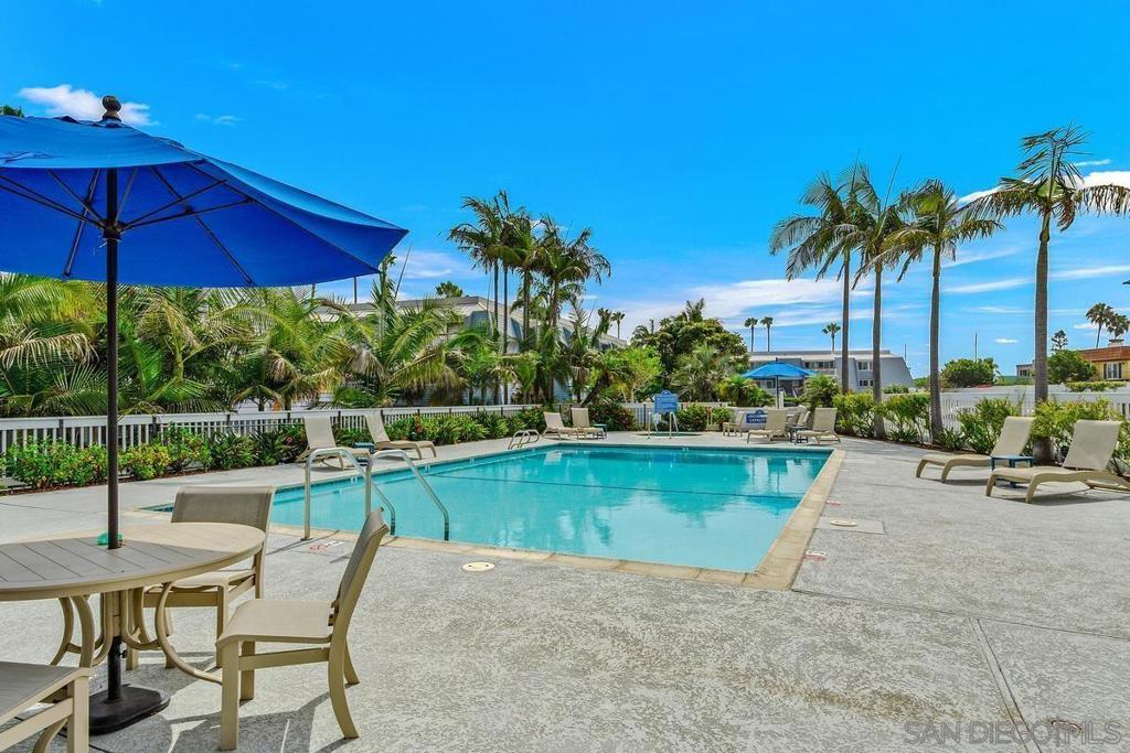 Stunning Coronado Bay View Condo with Modern Upgrades. Discover coastal living at its finest in this beautifully updated 2-bedroom, 2.5-bathroom condo located in the desirable Montego Village in Coronado, CA. This 1,492 square foot residence offers breathtaking city and bay views, providing a serene backdrop for your daily life. Recent Renovation includes the addition of an office space with upgraded insulation, allowing you to work from home in quiet privacy. New luxury vinyl plank (LVP) flooring throughout, new doors and hardware, new can lighting and a fresh coat of paint throughout the unit were all completed in October 2024. The spacious living area features a cozy fireplace and a private balcony with stunning Bay and San Diego skyline views. Perfect for relaxing while taking in a California sunset. The updated kitchen is equipped with modern stainless steel appliances a new kitchen Aid dishwasher and ample counter space. Two generously sized en-suite bedrooms each boast their own private bathrooms, offering comfort and privacy. The main bedroom has a large balcony with unobstructed west facing bay and bridge views. Community residents enjoy access to a swimming pool, spa, clubhouse/rec room, and the security of a gated community. The property includes a brand new private garage upgrade with 2 parking spaces and secure storage spaces for your personal items. Situated close to local attractions and with easy walk to Silver Strand State Beach. This condo combines luxury, comfort, and convenience. Walk or bike to the beach, bay and park.