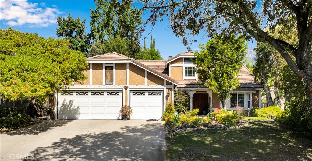 Beautiful home in North Upland, MASTER BEDROOM IS DOWNSTAIRS!, beautifully upgraded master bathroom, Upgraded Kitchen with Island, French doors off of master bedroom that leads to a beautifully landscaped backyard, The fourth bedroom (builder option) is currently set up as a loft, ideal for a home office, playroom, or media space, new double pane windows, brand new heat pump HVAC, newer roof, large loft area, beautifully landscaped yard, EV Tesla charging station, dual pane windows, minutes from the 210 freeway, highly rated school district, walking distance to Mcarthy park, near hiking and biking trails, close to the popular colonies shopping center!! Must see!!