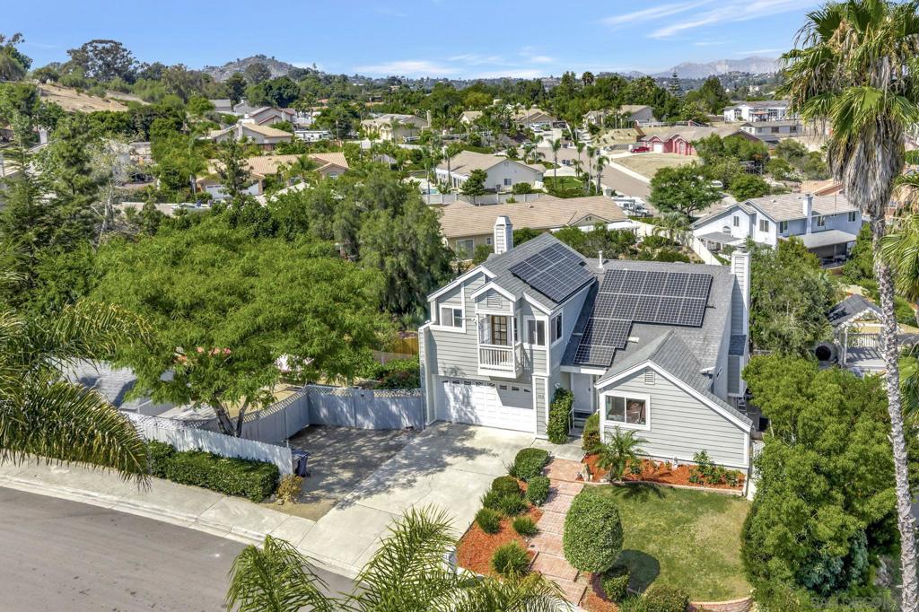 Rarely available 5 bedroom home on an oversized .26 acre lot with views in one of east county's most underrated pockets. Tucked away in a serene neighborhood surrounded by beautiful open space and hiking trails with quick freeway access and just minutes from all Rancho San Diego has to offer including shopping, restaurants, movie theater, and the well underway Calavo Park project. Beyond the charming curb appeal, this home offers a pleasantly livable layout with one bedroom and full bath on the main floor, a generous primary retreat with large soaking tub and a balcony on the top floor, and 3 bedrooms and a full bath on the bottom floor. The comfortable open living and dining space with high vaulted ceilings connect with a beautiful covered deck where you can enjoy views of the surrounding topography. Relax or entertain with two beautiful gas fireplaces in both the family room and livingroom. The lot is peaceful, versatile, and low maintenance offering fruit trees, space for boat or RV, a large Tuff shed, large flat grass ares, and raised garden beds. Home also features multi-zoned AC, Solar, Dual-Pane windows, stainless steel appliances, and a large 2 car garage. Ready for you to move right in and make this loved home your own.