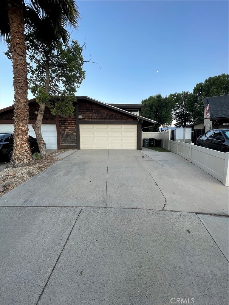 Welcome to this lovely 3 bedroom 2 bath, beautifully updated home, located in Lake Elsinore, at the foot of Ortega Mountain. Ideally located just minutes from the Lake Elsinore shore, on an expansive, lushly, manicured lot. This serene property blends refined interior details with a truly spectacular outdoor living experience. Inside, the home features rich LVP floors throughout the lower level, while the bedrooms and stairs feature plush, newer carpeting. Lower level has fresh paint, including bathroom, living, dining & kitchen. The kitchen has been beautifully remodeled with white cabinets, stainless steel appliances, and granite countertops with a stylish tile backsplash. Enjoy your meals in the cozy dining area, softly lit by natural light. With 3 bedrooms and 2 full bathrooms, including a highly desirable bedroom and full bath on the first floor, this home offers plenty of space and versatility, that ties the space together with style and warmth. Upstairs, the master bedroom and third bedroom await, along with a beautifully remodeled bathroom that is sure to satisfy! Step outside to the entertainer's dream backyard, complete with a covered patio with lights and a ceiling fan, whether you’re hosting guests or savoring quiet mornings, this backyard oasis is your private sanctuary Easy-to-maintain artificial turf, storage shed, and vinyl fencing, this space is truly amazing with views of the mountains! This home also has a two-car garage, low taxes, and no HOA fees. Conveniently located near shopping, dining, and major throughfares like the Ortega Hwy and the 15 freeway, this home has it all. With its timeless upgrades, and unbeatable location near the lake shore, this home offers the perfect blend of luxury and laid-back California living. Call to schedule a private showing appointment!