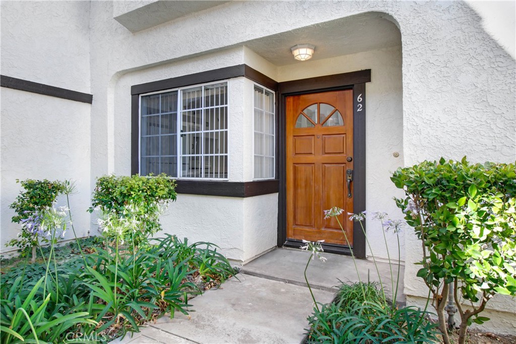 Reduced for immediate sale! Fantastic REMODELED and UPGRADED END UNIT two story townhome in a great interior location. The townhome overlooks and beautiful greenbelt and pool area. There are two large bedrooms each with an ensuite. The primary bathroom features a huge walk in shower and vanity with double sinks. The primary suite has two closets, one a walk-in closet and the other complete with custom cubbies and shelves and a large balcony that overlooks the green belt and pool areas. There is a guest bathroom on the lower level. The living room boasts a fireplace, wall sconces and a patio with direct access to the pool area. There is a separate laundry room with newly replaced washer and dryer. The remodeled kitchen has a breakfast bar with pendant lighting and quartz counters. This townhome has recessed lighting throughout and a conveniently located two car garage just steps from the townhome. The complex includes two pools and spas, a club house and sauna. Walk to restaurants and stores and easy access to hiking trails. Free shuttle to The Commons and other locations conveniently picked up from the from of the complex.